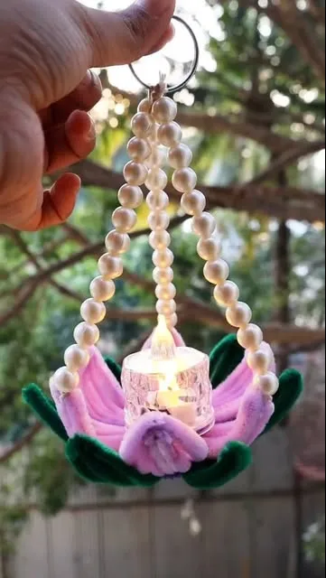 Hanging pink chenille lotus tea-light holder with pearl strings